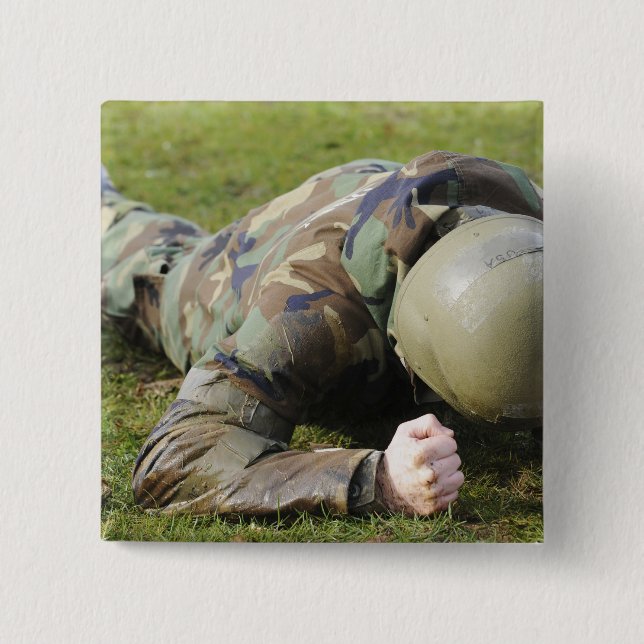 Airman crawls through a wet field 2 inch square button (Front)