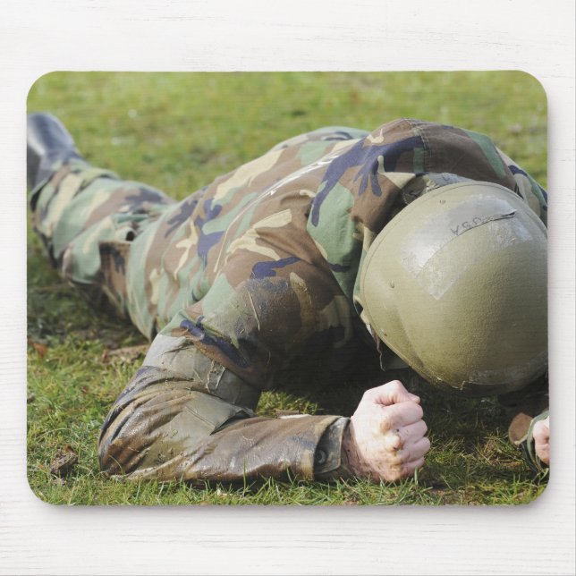 Airman crawls through a wet field mouse pad (Front)