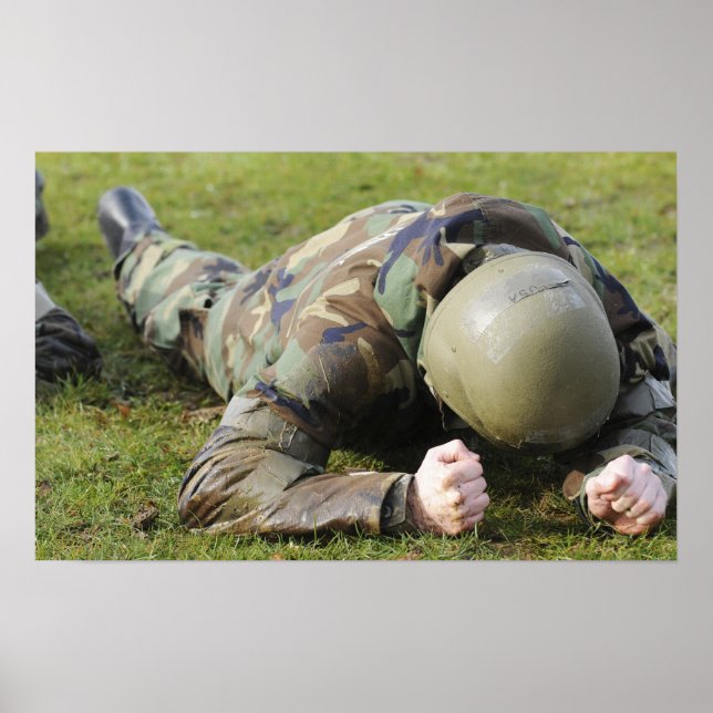 Airman crawls through a wet field poster (Front)