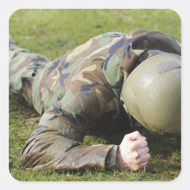 Airman crawls through a wet field square sticker (Front)