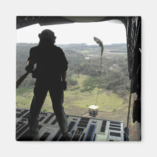 Airman watches a practice bundle fall magnet