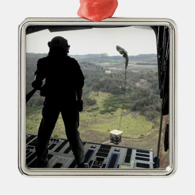 Airman watches a practice bundle fall metal ornament (Front)