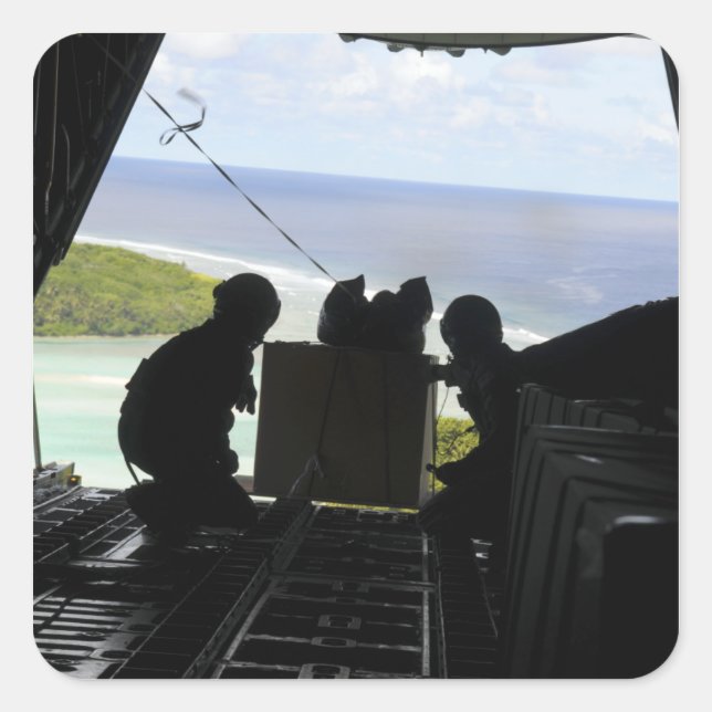 Airmen push out a pallet of donated goods square sticker (Front)