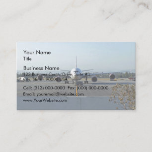 Airplane at airport with blue sky in background business card