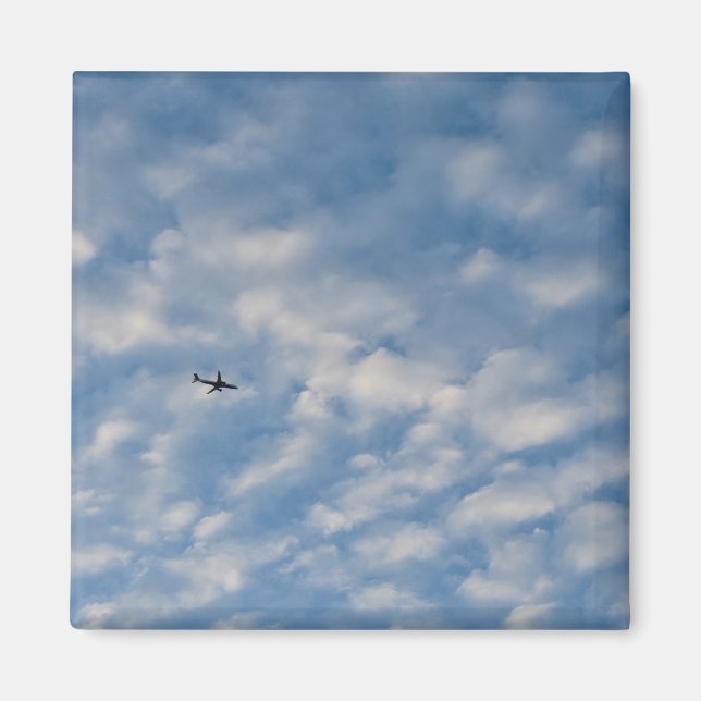 Airplane Crossing a Cloud-Filled Blue Sky Magnet (Front)