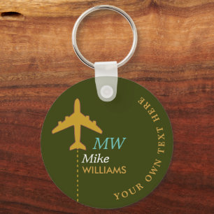 airplane on greenish keychain with name