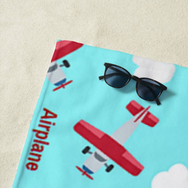 Airplane pattern on blue beach towel (In Situ)