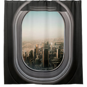 AIRPLANE WINDOW VIEW OF CITY DURING DAYTIME