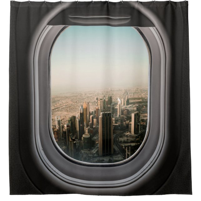 AIRPLANE WINDOW VIEW OF CITY DURING DAYTIME (Front)