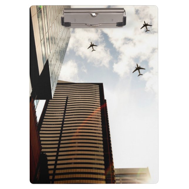 Airplanes flying over buildings clipboard (Front)