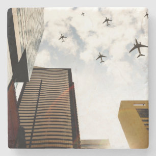Airplanes flying over buildings stone coaster