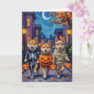 Akita Dogs Trick-or-Treating in Halloween Costumes Card
