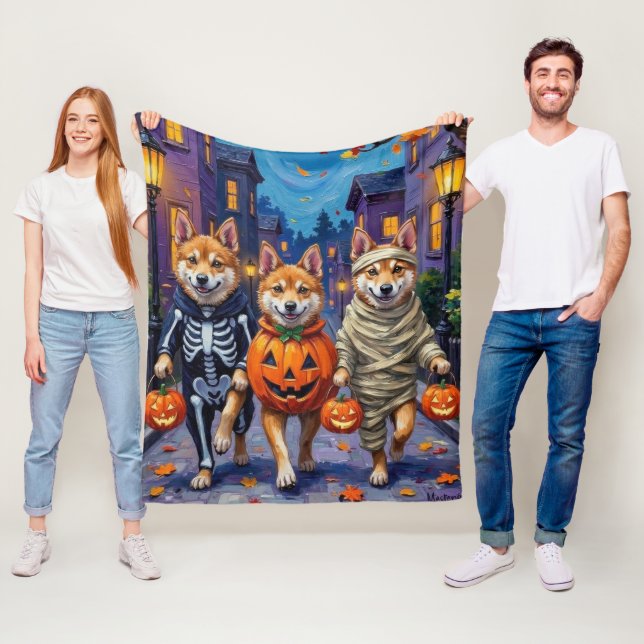 Akita Dogs Trick-or-Treating in Halloween Costumes Fleece Blanket (In Situ)