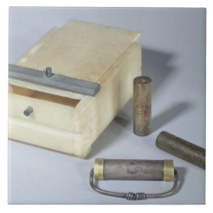 Alabaster box and bronze and silver seal cylinders tile