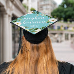 Alabaster Floral | Custom Name and Class Year Graduation Cap Topper<br><div class="desc">Stand out in the crowd! This beautiful grad cap topper features the graduate's name in elegant white calligraphy script,  on a vibrant,  eyecatching aqua background adorned with white watercolor flowers and green foliage. Personalize with your class year and/or school beneath.</div>