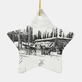 Alaskan Sled Dogs Standing Outside a Log Cabin Ceramic Ornament
