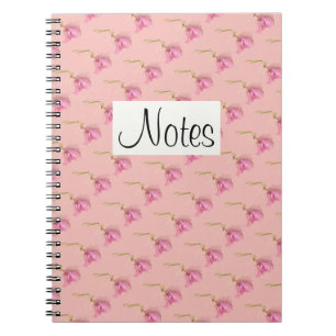 All-over pink floral print hellebore on pink notebook