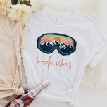 ALLIE Ski Snowboarding Bride Vibes Bachelorette T-Shirt<br><div class="desc">This t shirt features bride vibes colourful ski goggles and a fun handwritten font. This shirt,  when paired with the mountain vibes t shirt,  makes the perfect cohesive look for your ski or snowboarding mountain bachelorette getaway.</div>