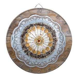 Almond nut cake on rustic wood dartboard