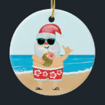 Aloha Hawaiian Santa Tropical Beach Christmas Ceramic Ornament<br><div class="desc">Christmas holiday ornament features a cute Santa on a tropical beach wearing red and white Hawaiian print shorts with a hibiscus pattern,  sipping from a pineapple and flashing the Aloha sign. Original artwork KL Stock</div>