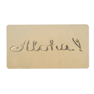Aloha signe sur le sable de la plage