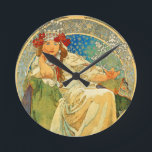 Alphonse Mucha Art Nouveau Princess Hyacinth Round Clock<br><div class="desc">Clock featuring Alphonse Mucha’s lithographic poster Princess Hyacinth (1911). Commissioned for the eponymous ballet, the art depicts a princess—who is actually the dream a blacksmith has of his daughter—sitting upon a green throne in a white dress and wearing a crystal crown. She wraps a finger around a snowflake. A great...</div>