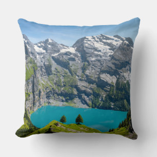 Alpine lake Oeschinensee in Switzerland Throw Pillow