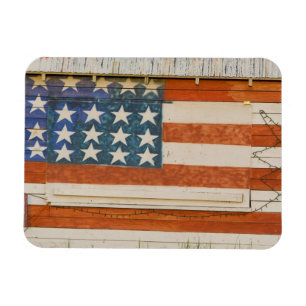 American flag painted onto fireworks stand near magnet