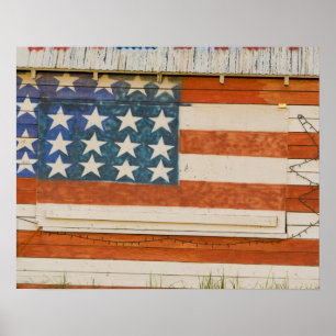 American flag painted onto fireworks stand near poster