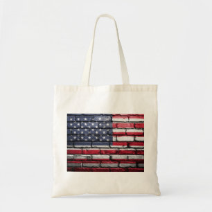 American flag painting on a brick wall tote bag