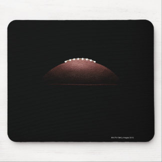 American football ball on black background mouse pad