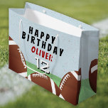 American Football Balls Kids Happy Birthday Large Gift Bag<br><div class="desc">American Football Balls Kids Happy Birthday Gift Bag. Football themed birthday gift bag with child`s name,  age and football balls. Add your name and age. Great for kids who love football and sports.</div>