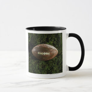 American football on grass, view from above mug