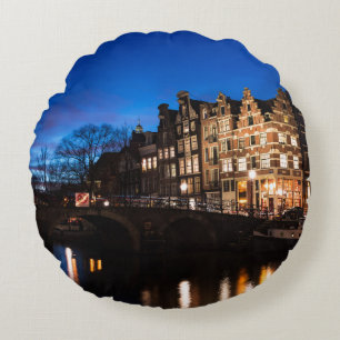 Amsterdam canal houses at night round pillow