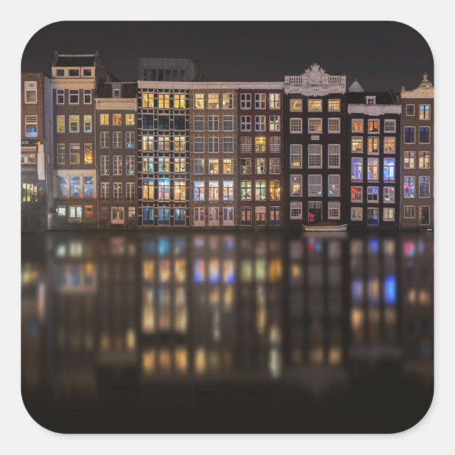 Amsterdam houses with colourful lights in the nigh square sticker (Front)