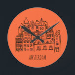 Amsterdam Netherlands Holland City Souvenir Orange Round Clock<br><div class="desc">Amsterdam is the capital and most populous municipality of the Kingdom of the Netherlands. Best souvenirs from the city as a gift. Holland attracks a lot of tourists every year. Have you not visited the beautiful city Amsterdam yet. Perfect gifts for Amsterdam, Holland.</div>