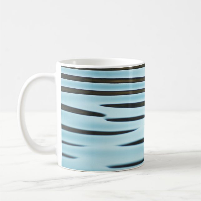 An abstract wave ripple background made from water coffee mug (Left)