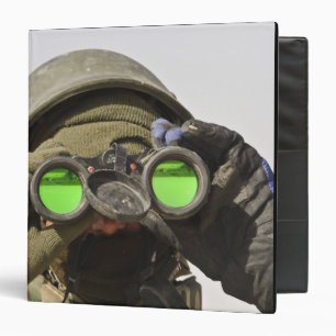 An Afghan soldier scans the horizon Binder