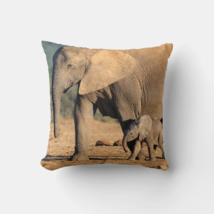 An African Elephant mother and calf on the move Throw Pillow