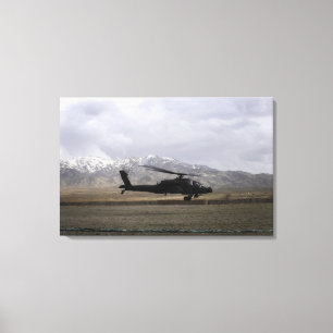 An AH-64A Apache taking off Canvas Print