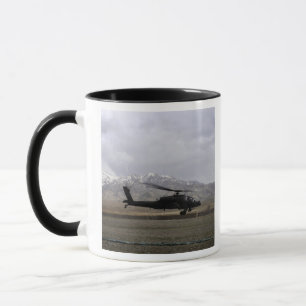An AH-64A Apache taking off Mug