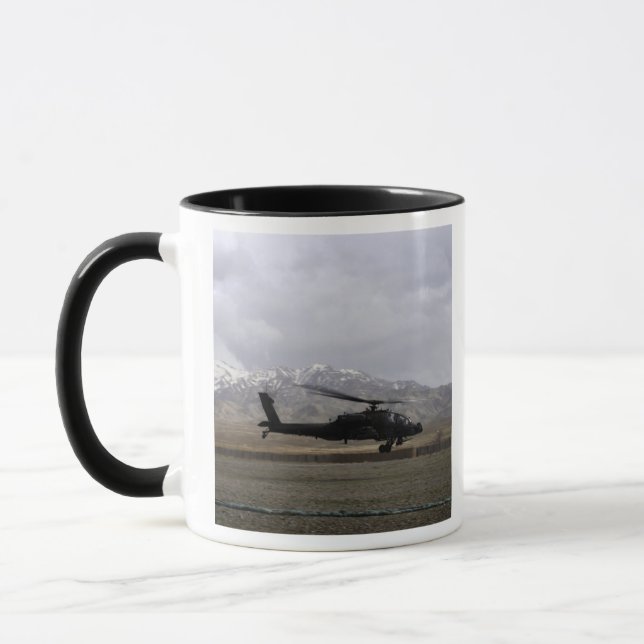 An AH-64A Apache taking off Mug (Left)