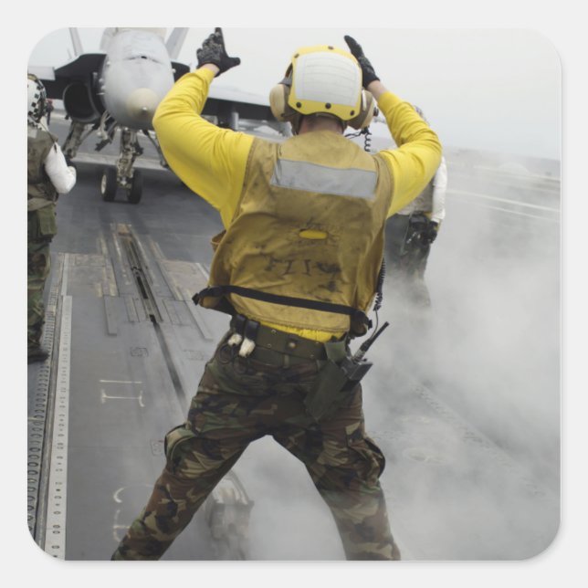 An aircraft director signals a F/A-18C Hornet Square Sticker (Front)