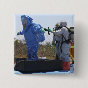 An airman stands in a tub 2 inch square button