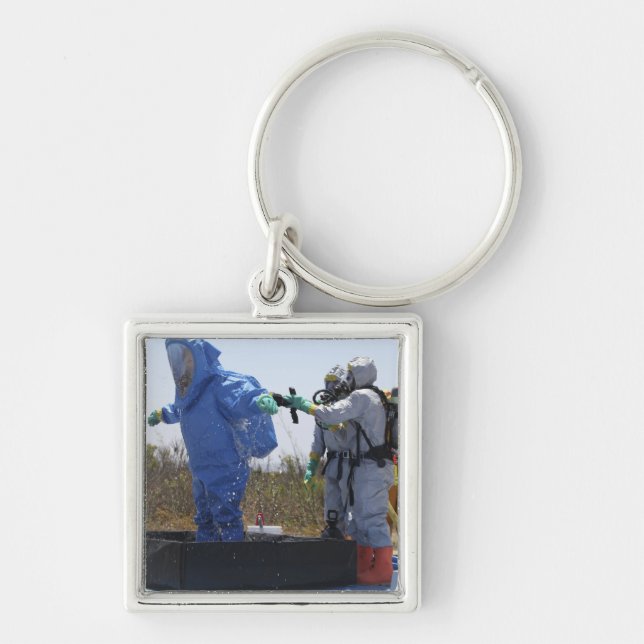 An airman stands in a tub keychain (Front)