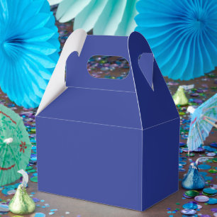 an airplane flying in the sky favor box