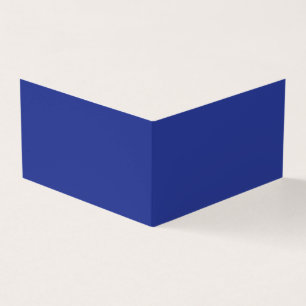 an airplane flying in the sky with a blue backgrou