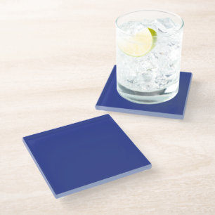 an airplane flying in the sky with a blue backgrou glass coaster