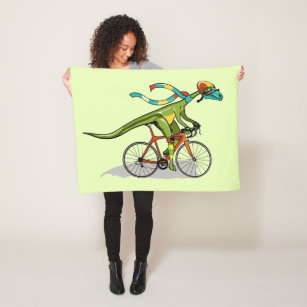 An Anabisetia Dinosaur Riding A Bicycle. Fleece Blanket