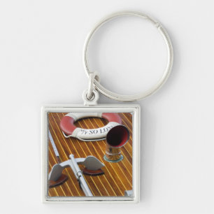 An Anchor And A Life-Buoy On A Wooden Boat Keychain